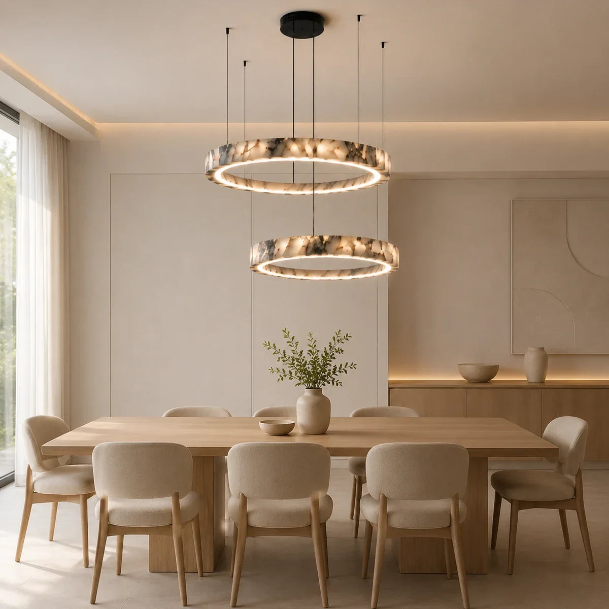 MarbleGlow duo ring chandelier above a bright dining table