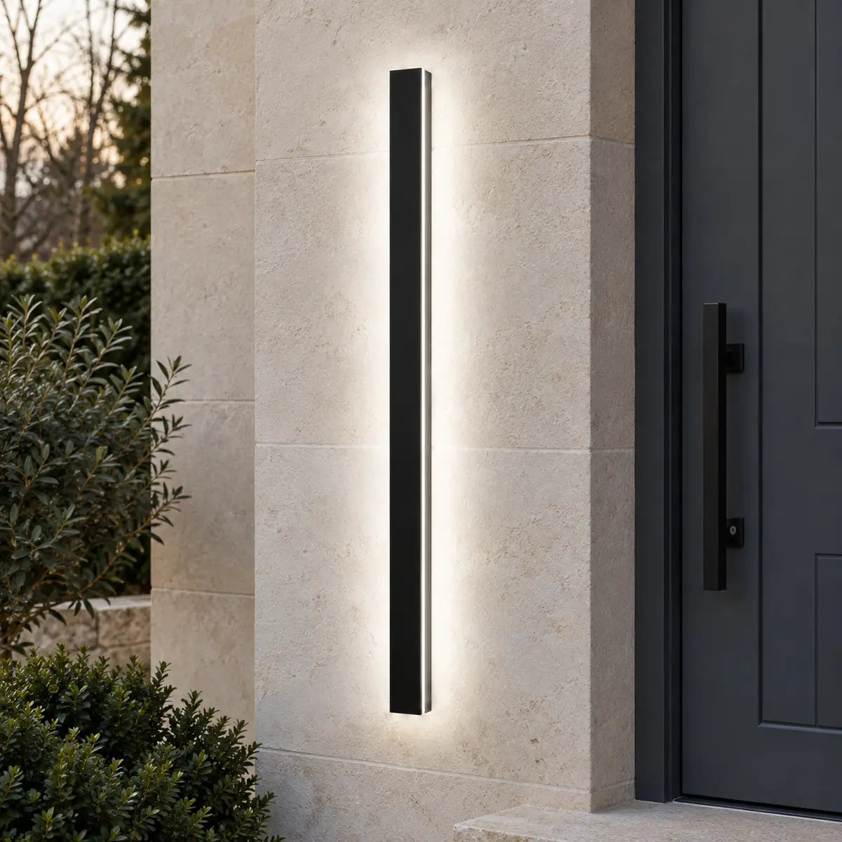 SilexStone black outdoor wall light with white light beside a modern entrance