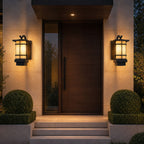 Pair of craftsman lanterns flanking a timber front door with clipped box balls