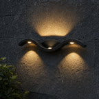 Close-up of the wave form on dark stone showing all three LED lenses lit