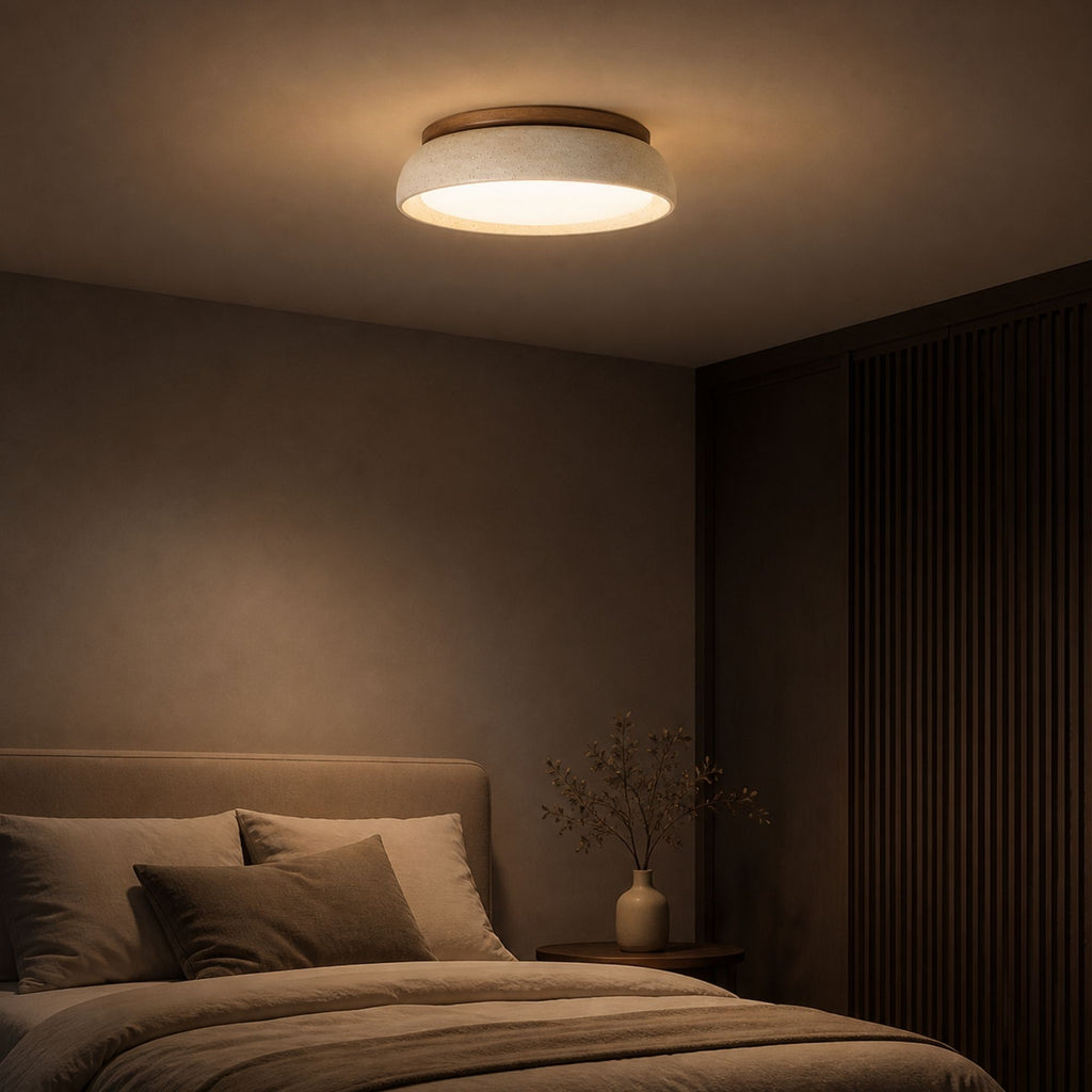 TravertineGlow ceiling light in natural beige travertine and wood finish illuminating modern bedroom with warm ambient LED lighting