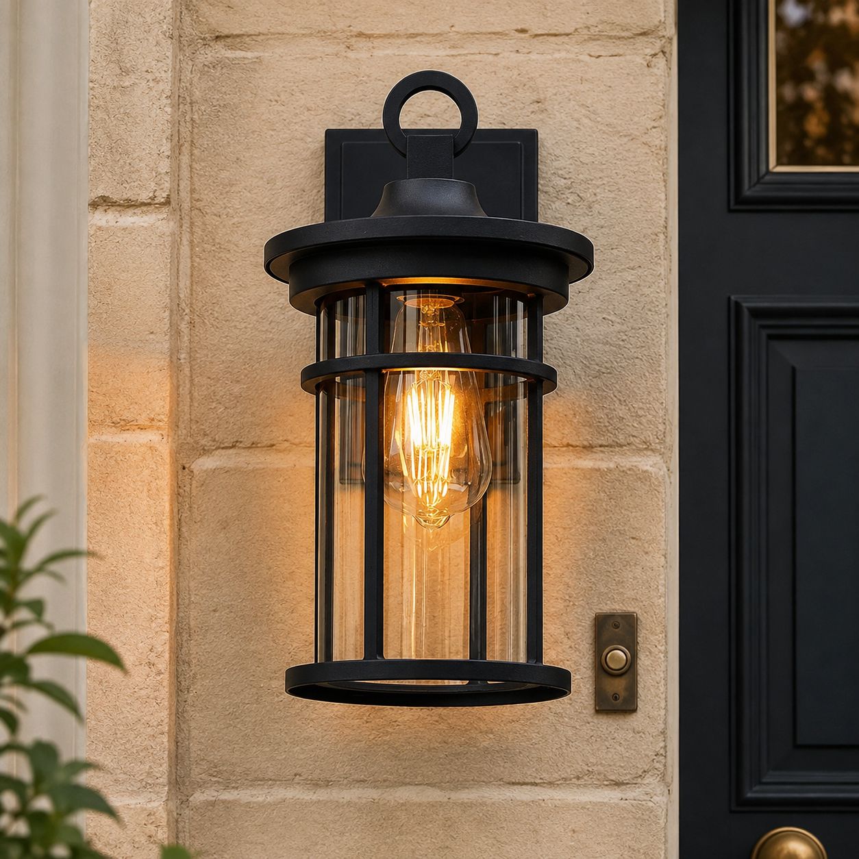 Close view of the caged glass lantern on pale stone beside a dark door