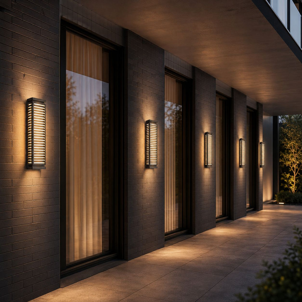 Row of louvre wall lights along a modern facade between tall windows