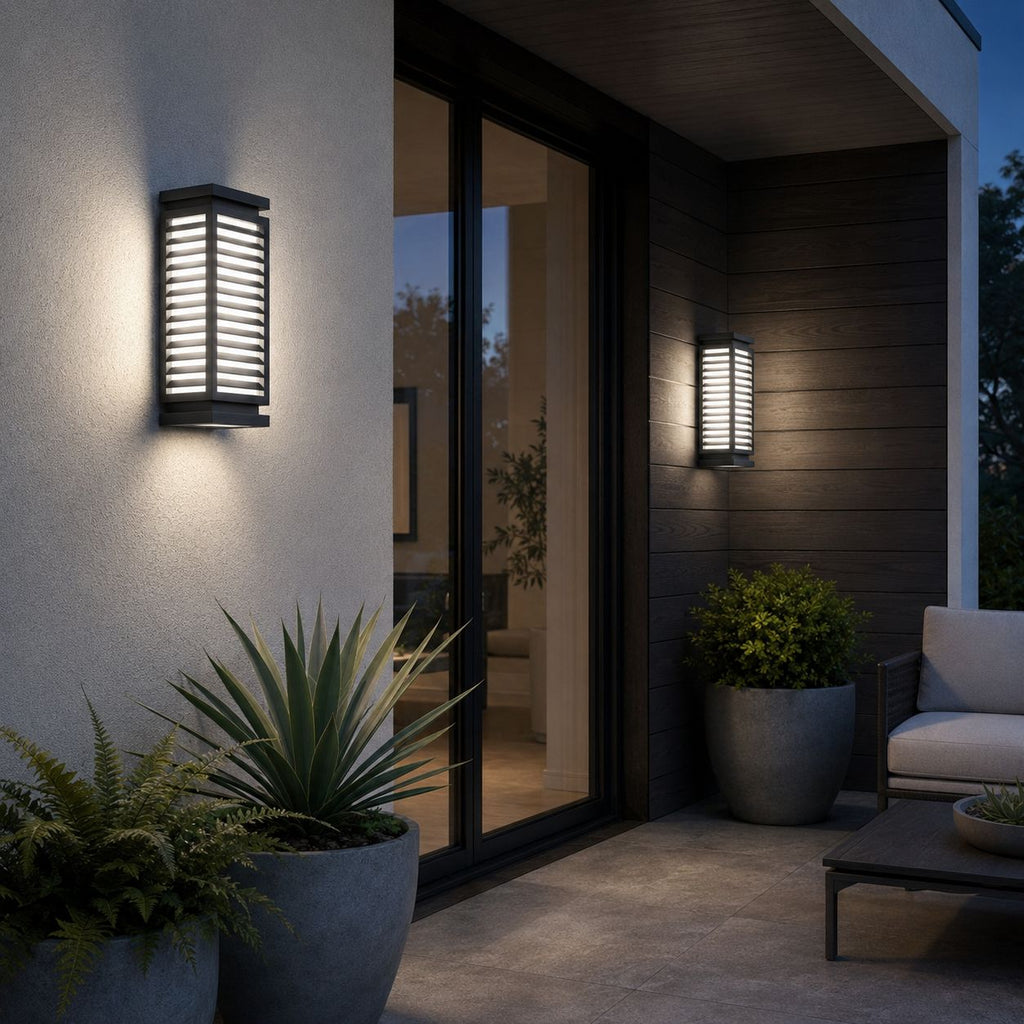 Louvre wall light on white render beside glass doors and agave planting