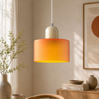 Bauhaus_inspired_orange_glass_pendant_lamp_with_soft_warm_glow_2