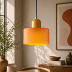 Bauhaus_inspired_orange_glass_pendant_lamp_with_soft_warm_glow_2