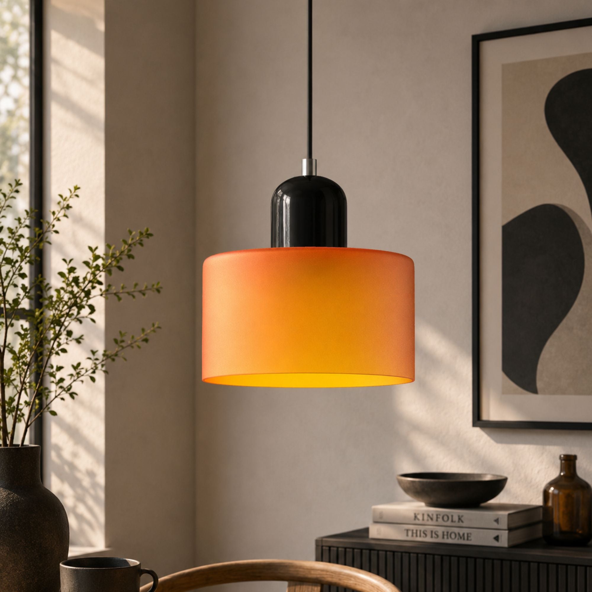 Bauhaus_inspired_orange_glass_pendant_lamp_with_soft_warm_glow_2