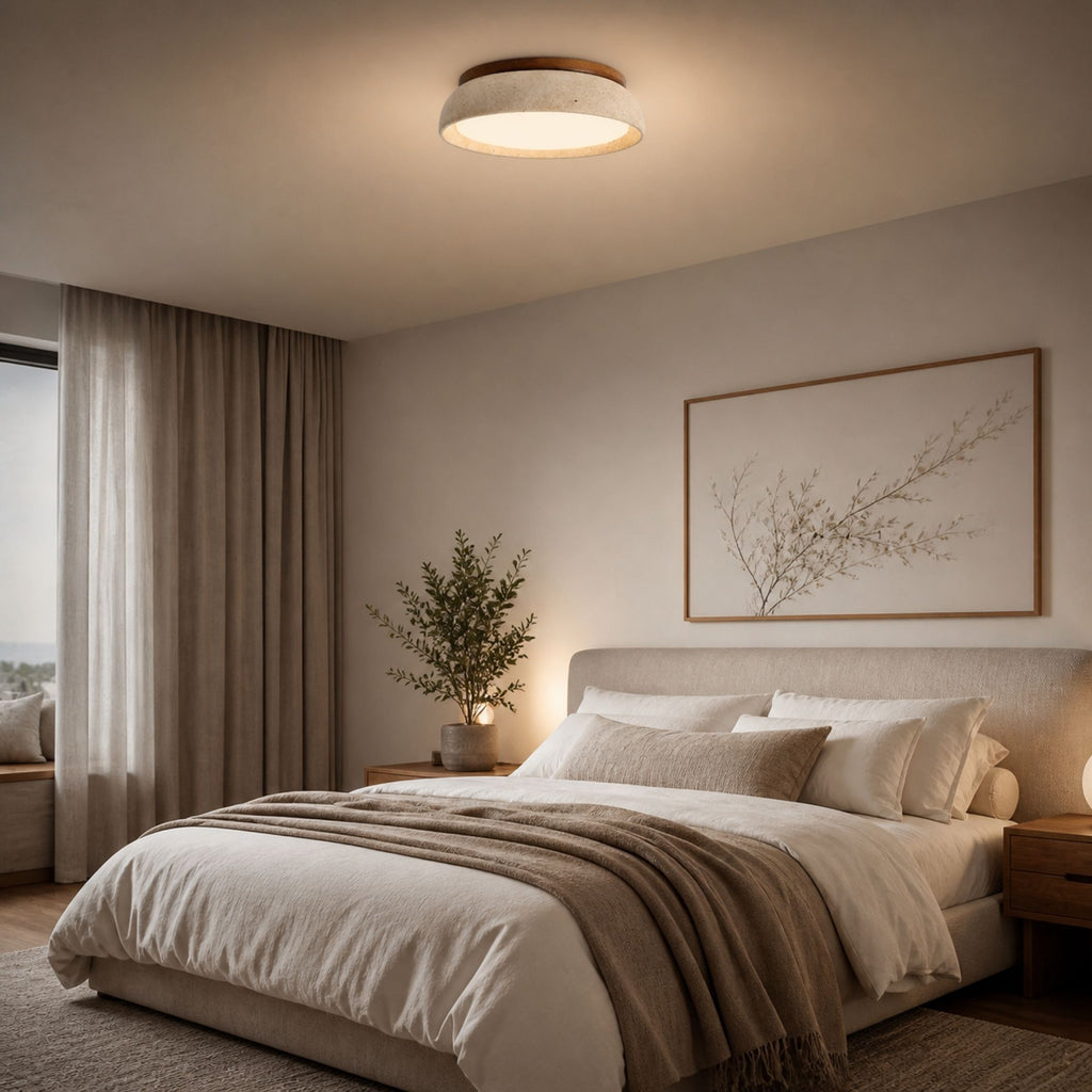 Modern travertine ceiling light in beige stone and wood design installed in minimalist bedroom with soft neutral decor