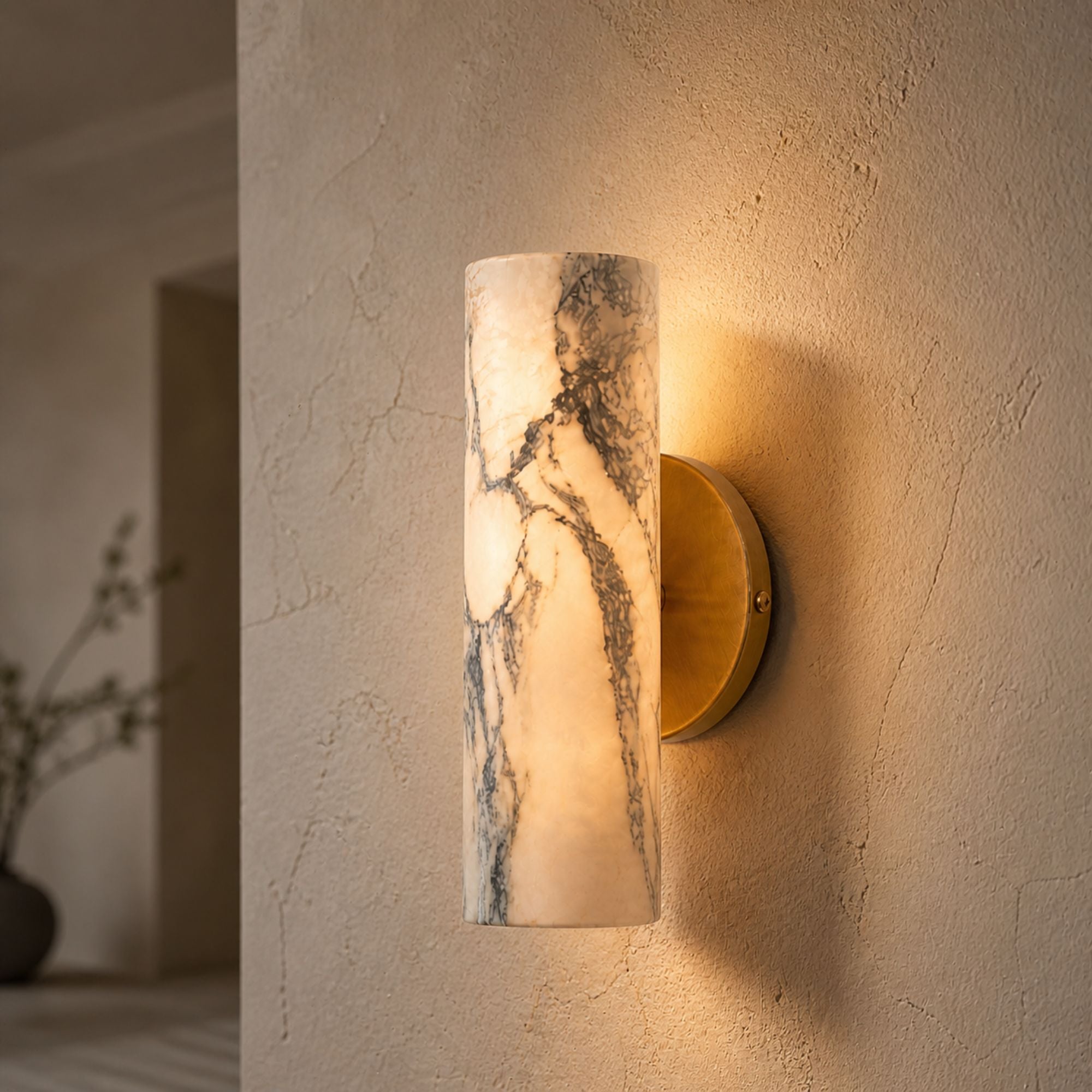 Modern marble wall lamp with brass base for warm ambient lighting