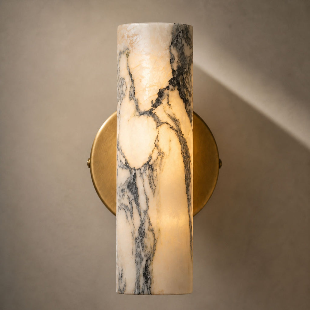 Marble wall lamp with warm light glow and natural stone texture detail
