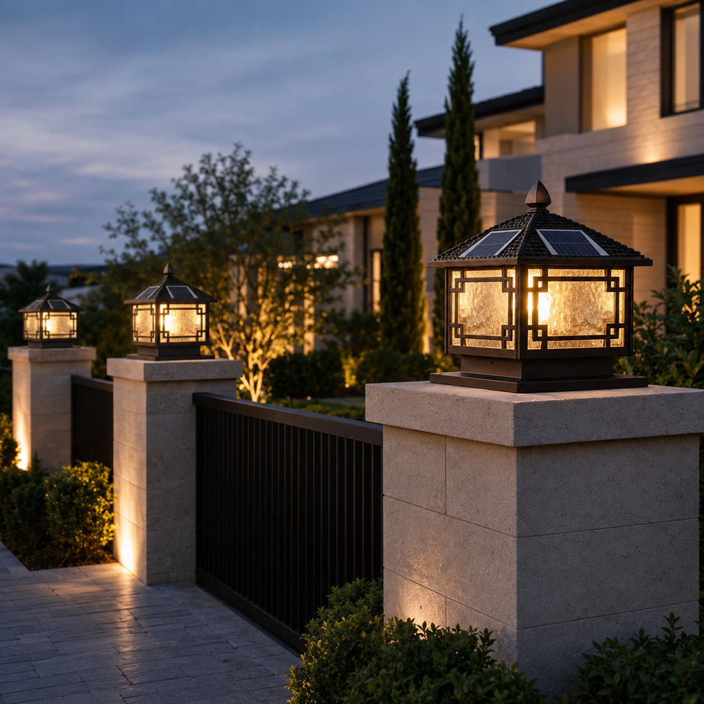 Four pillar cap lanterns along a run of stone gate posts outside a two-storey house