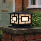 Pagoda pillar light on a mossy brick pier beside a green front door