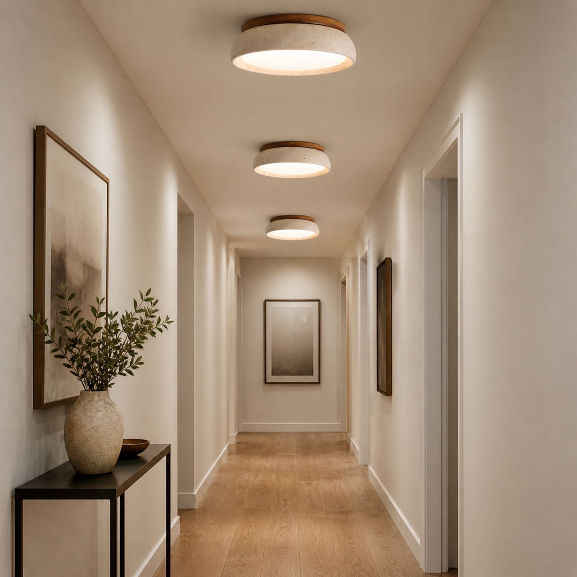 Travertine ceiling lights in beige natural stone and wood finish aligned in modern hallway with warm LED illumination