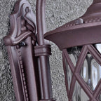 Macro detail of the scrolled arm and diamond lattice in the coffee finish