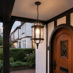 Domed pendant lantern beside an arched timber front door