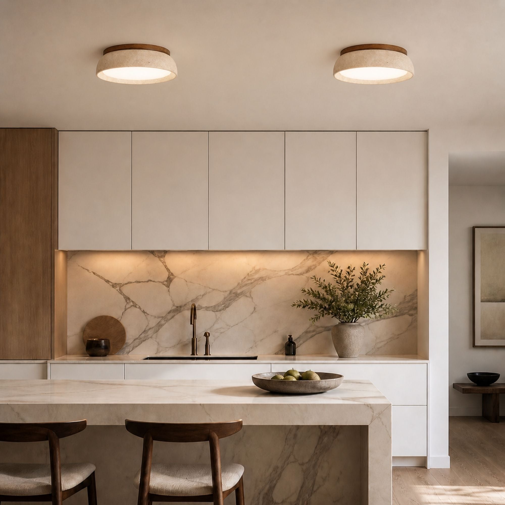 TravertineGlow ceiling light in beige stone and wood finish installed in modern kitchen with marble backsplash and soft lighting