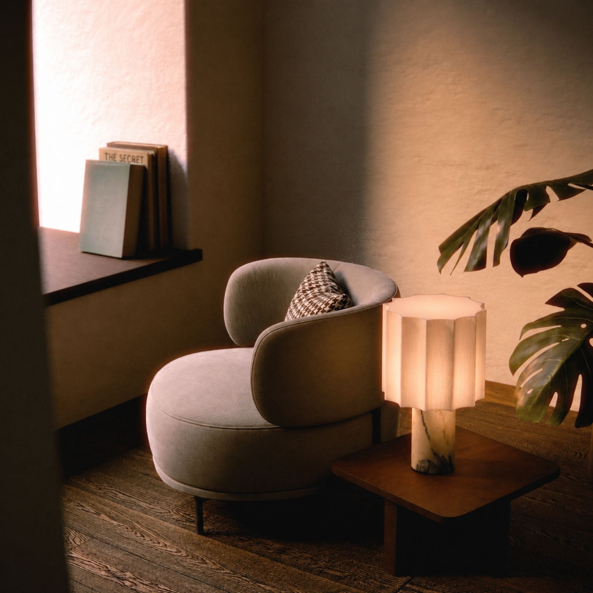 Calacatta marble table lamp with linen shade on wooden side table in cozy modern living room setting