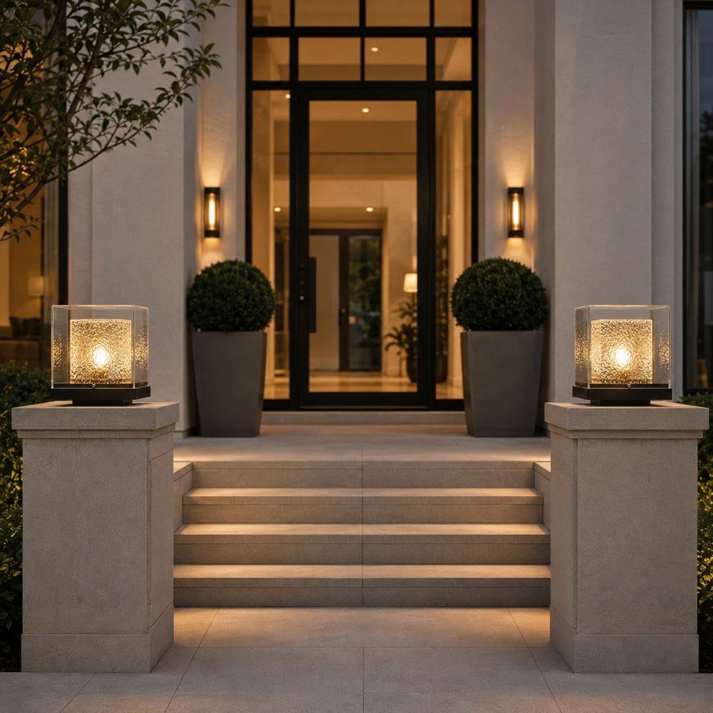 Two post cap lights on stone piers flanking the steps to a modern entrance