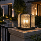 Crackle effect pillar light in the rain, water beading on the textured shade