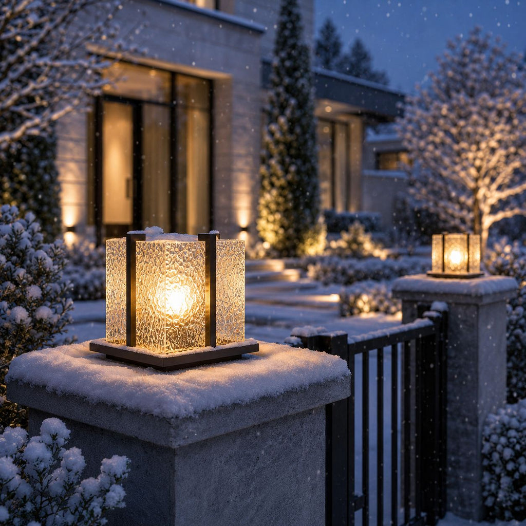 Crackle effect pillar light with snow settled on the pier cap in winter