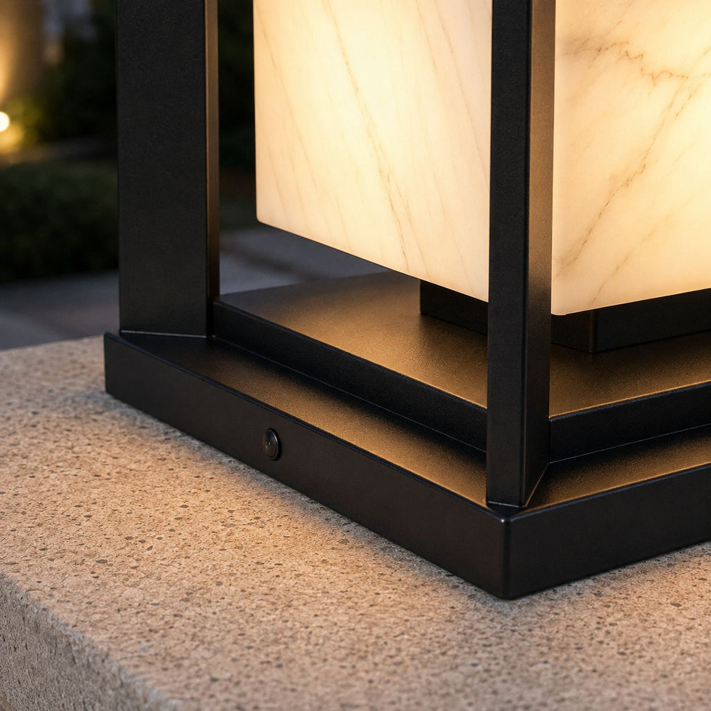 Close-up of the base showing the marble veining and the control button