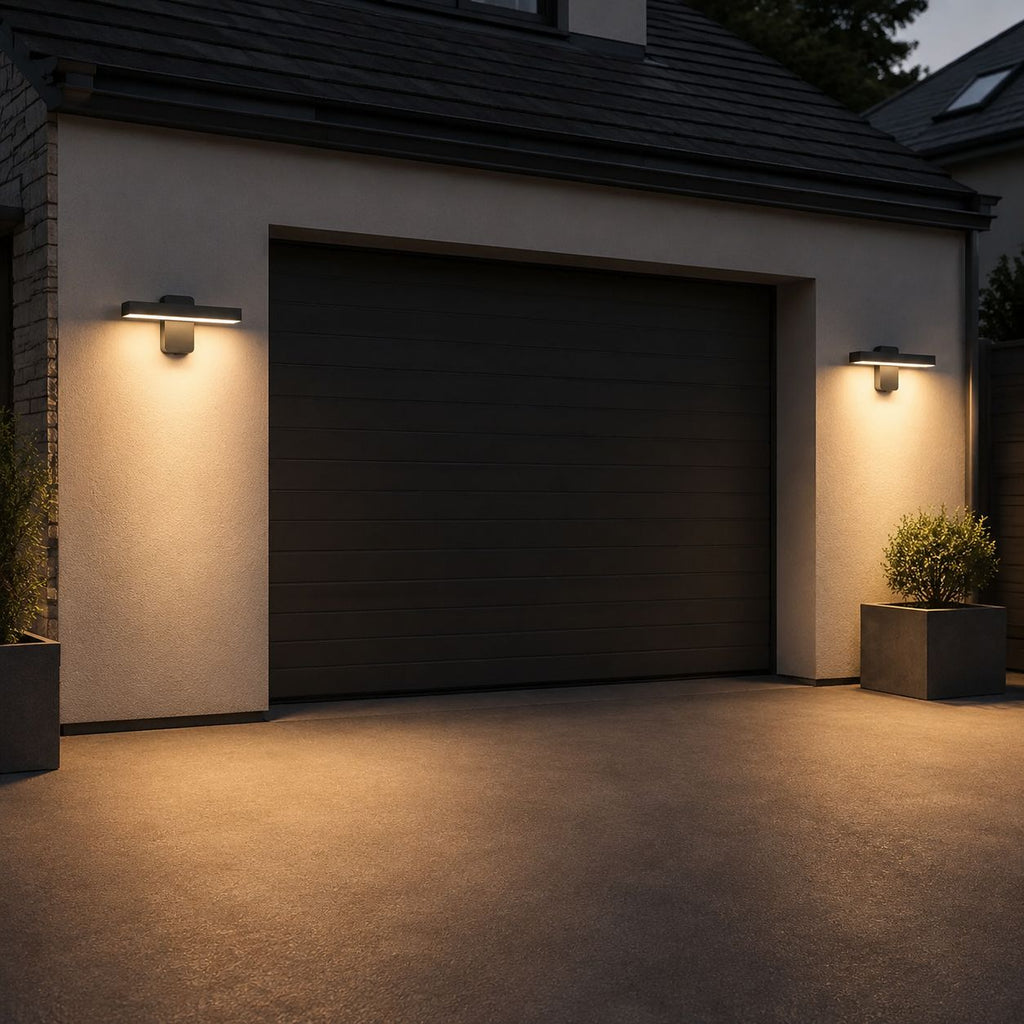 Two linear LED bar wall lights either side of a garage door
