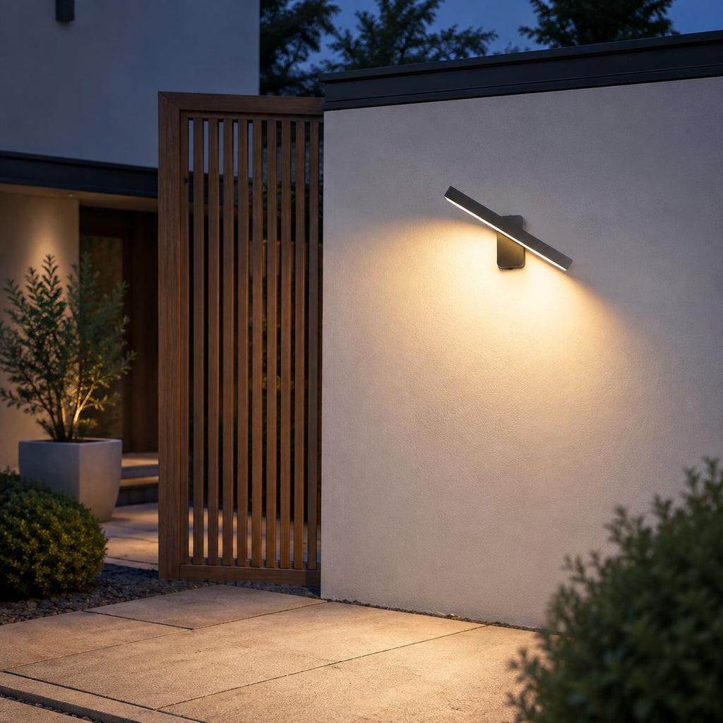 Linear LED bar wall light on a rendered wall beside a slatted timber screen
