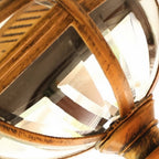 Detail of the ribbed metal band meeting the clear glass dome