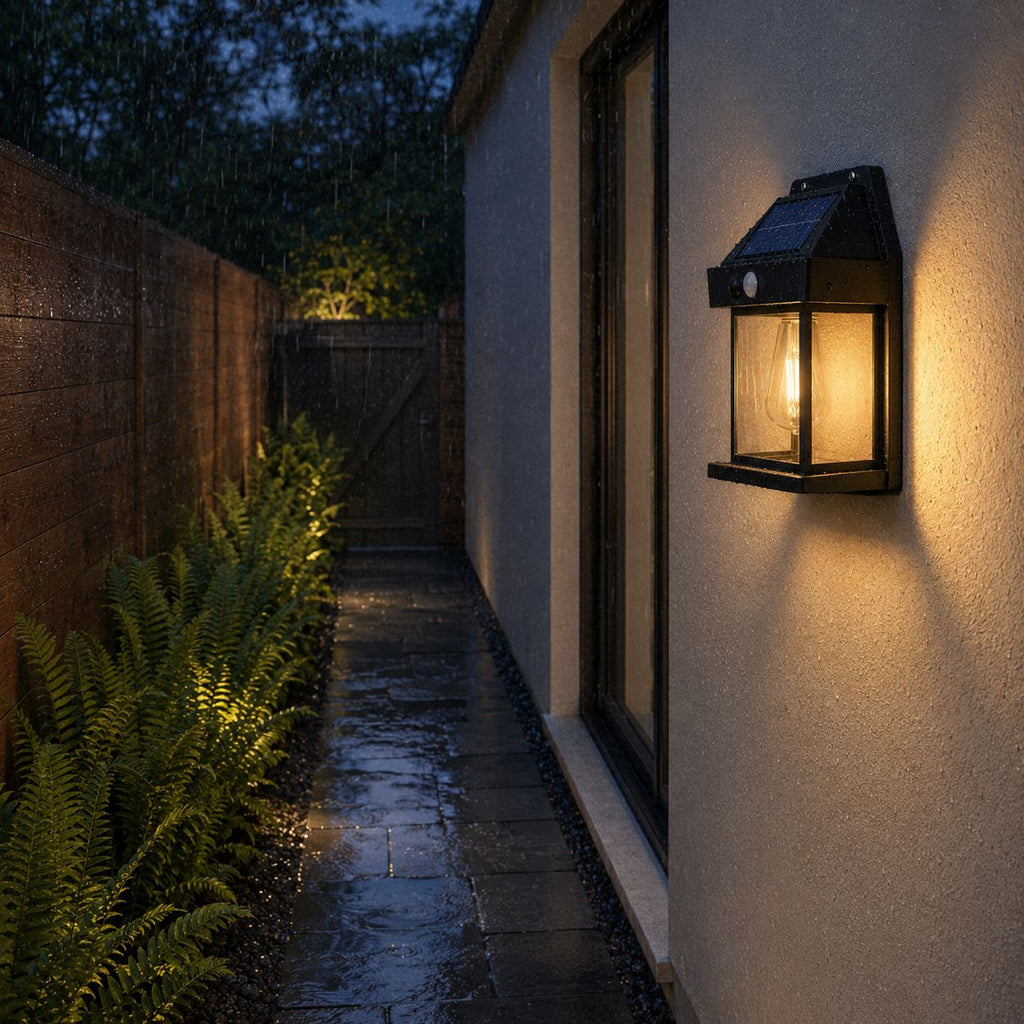 Solar motion sensor lantern lighting a narrow side passage in the rain