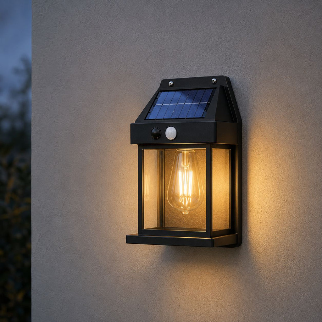 Full view of the black solar lantern showing the panel, PIR sensor and filament bulb
