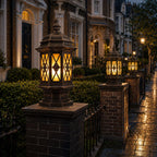 Two hexagonal pillar lanterns on brick gate posts along a wet Victorian street
