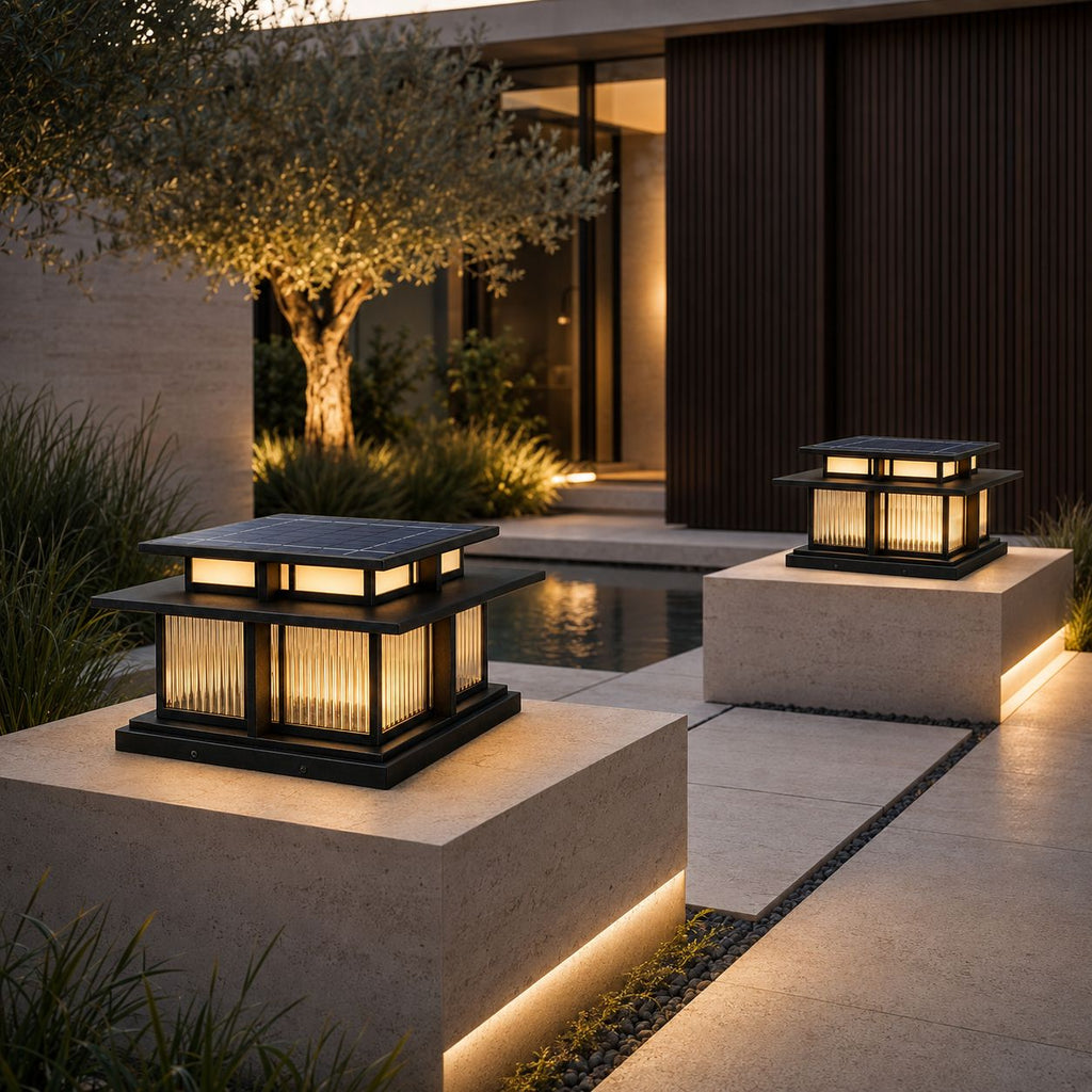 Two pier lanterns on stone piers beside an olive tree and dark timber wall