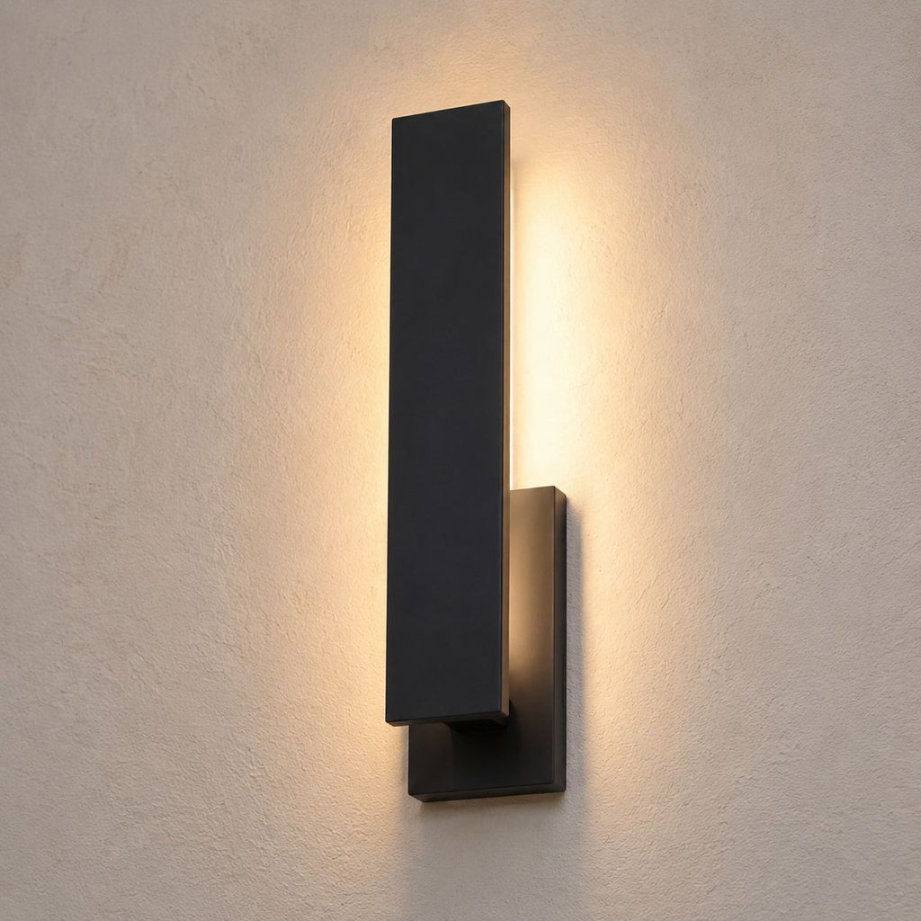 Detail crop of the aluminium blade and the soft vertical wash of light on the wall