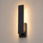 Detail crop of the aluminium blade and the soft vertical wash of light on the wall