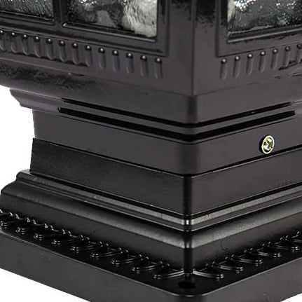 Close-up of the ribbed base and tiered cap of the scrollwork pillar light