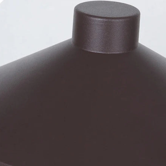 Macro detail of the metal umbrella shade and its bronze finish