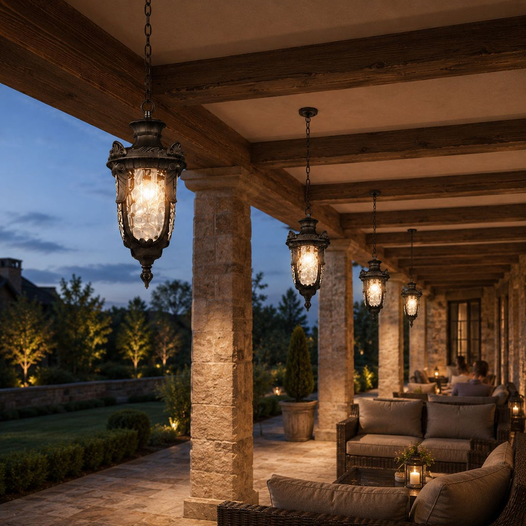 Row of hammered glass pendant lanterns along a stone colonnade at dusk