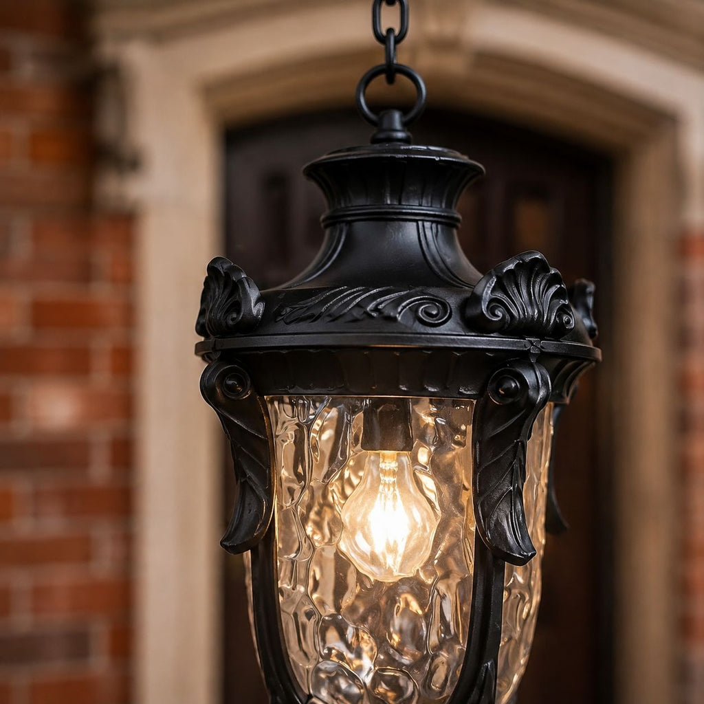 Close view of the cast crown and acanthus detailing above the hammered glass