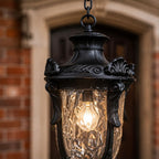 Close view of the cast crown and acanthus detailing above the hammered glass
