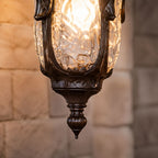 Macro of the rippled hammered glass and turned finial