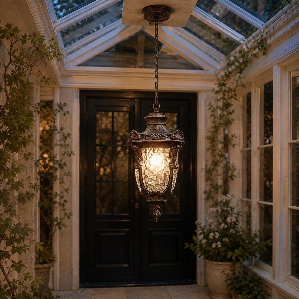 Hammered glass pendant lantern in a glass-roofed porch above a front door