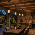 Four hammered glass pendant lanterns along a timber outdoor kitchen ceiling