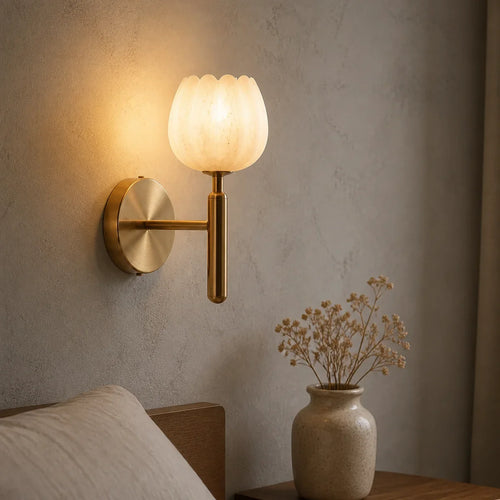 AlabasterGlow brass natural alabaster wall sconce in a warm bedroom