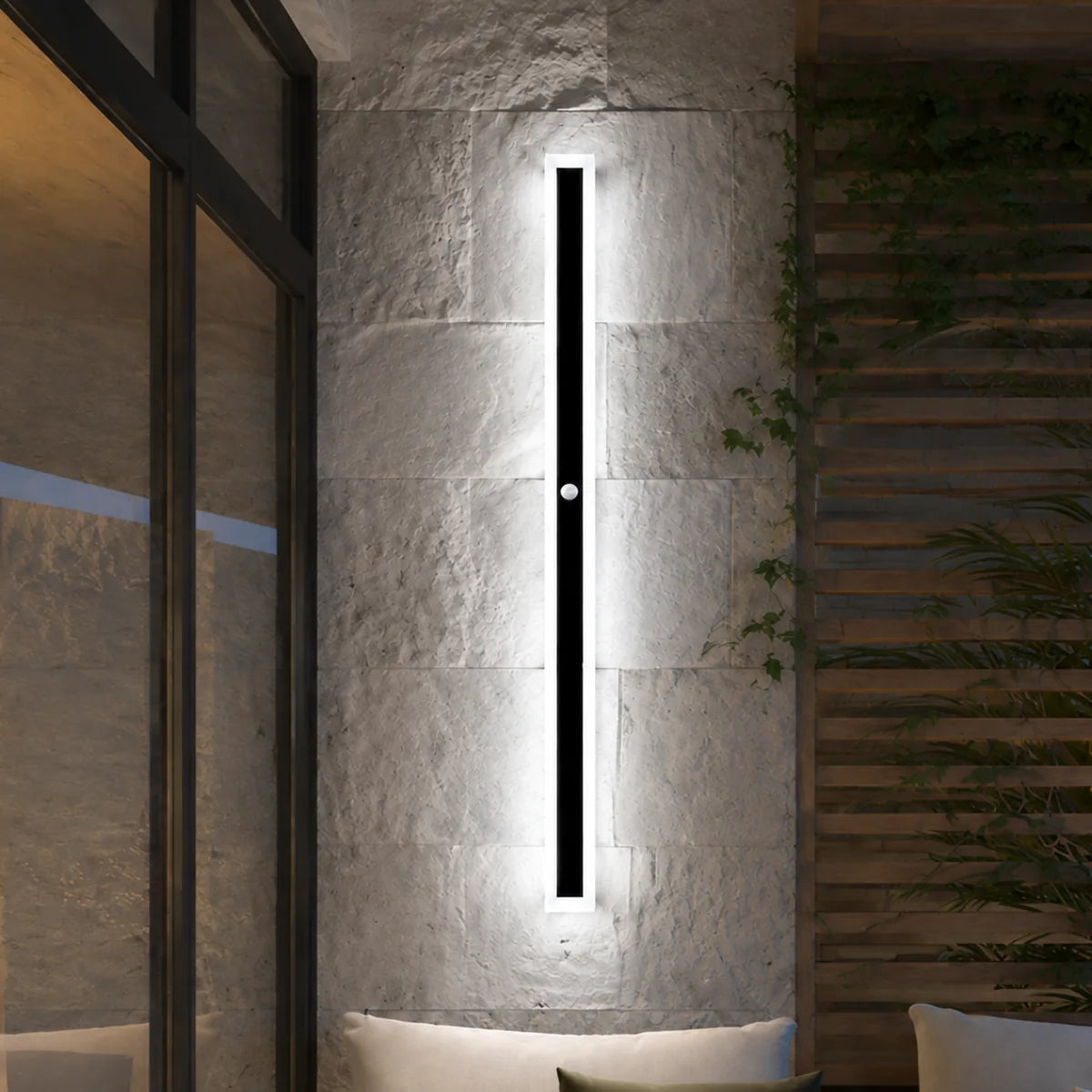 AquaLuxe cool white motion sensor wall light on a stone patio wall