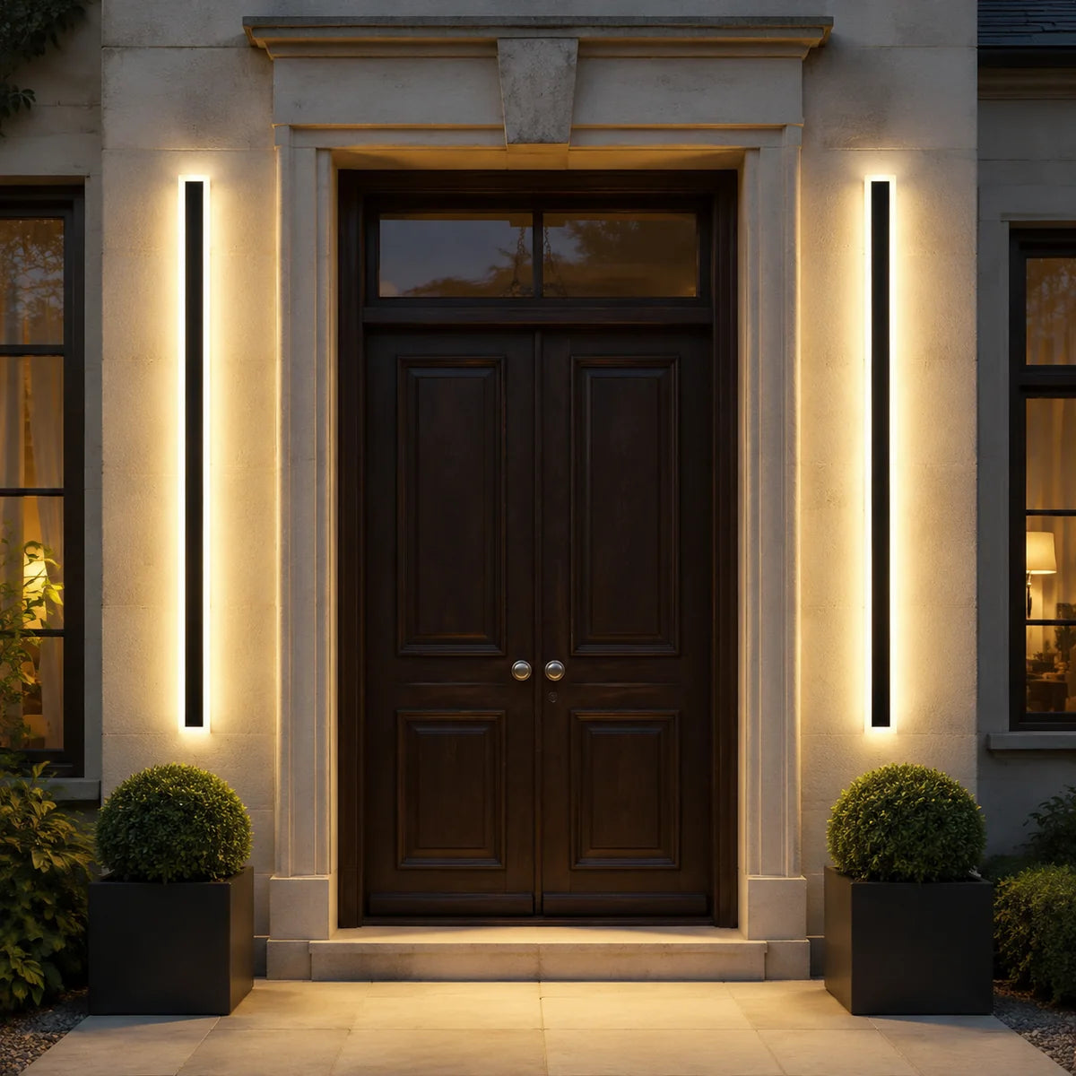 Two AquaLuxe warm white steady wall lights framing an entrance