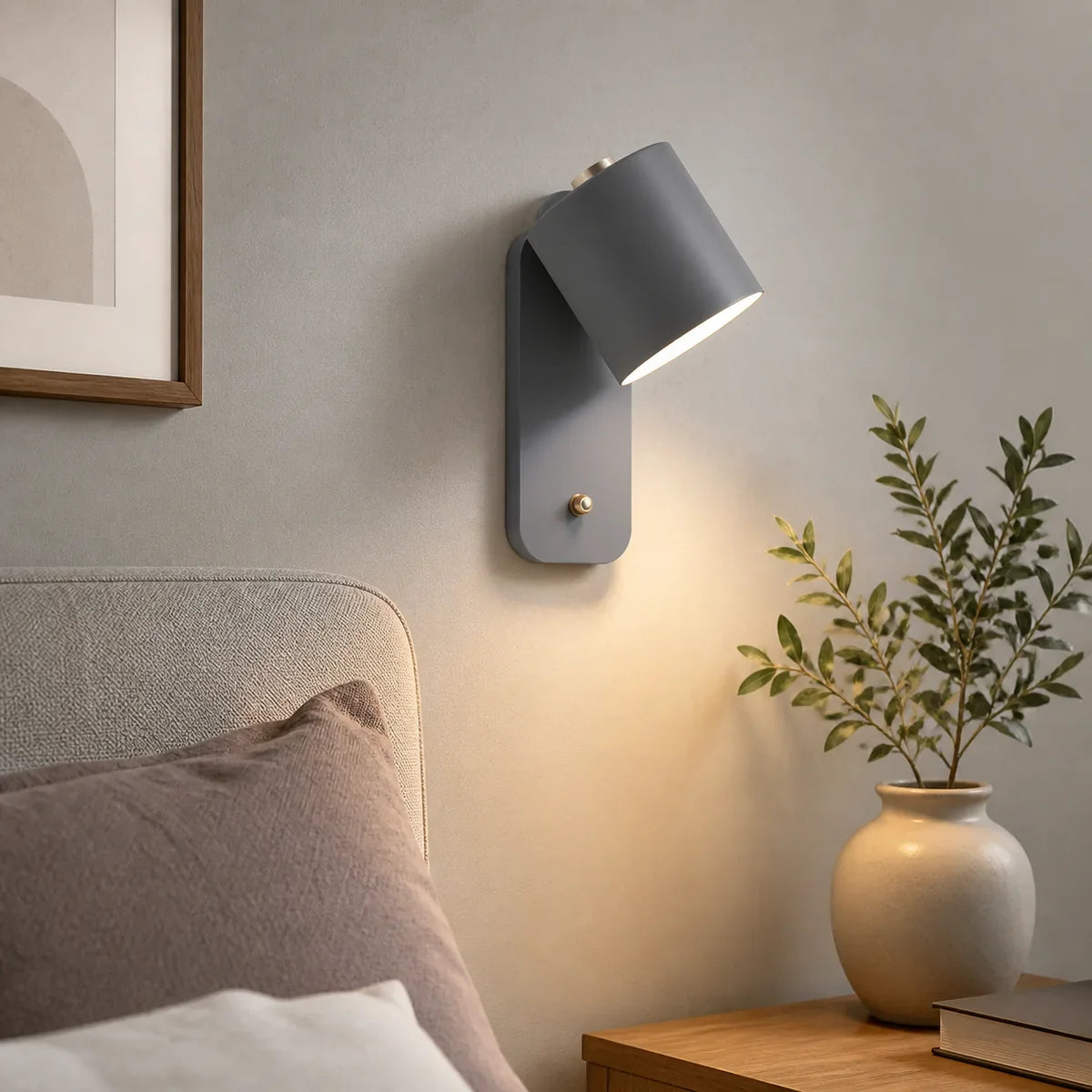 Cylindra grey adjustable reading wall light in a close bedroom setting