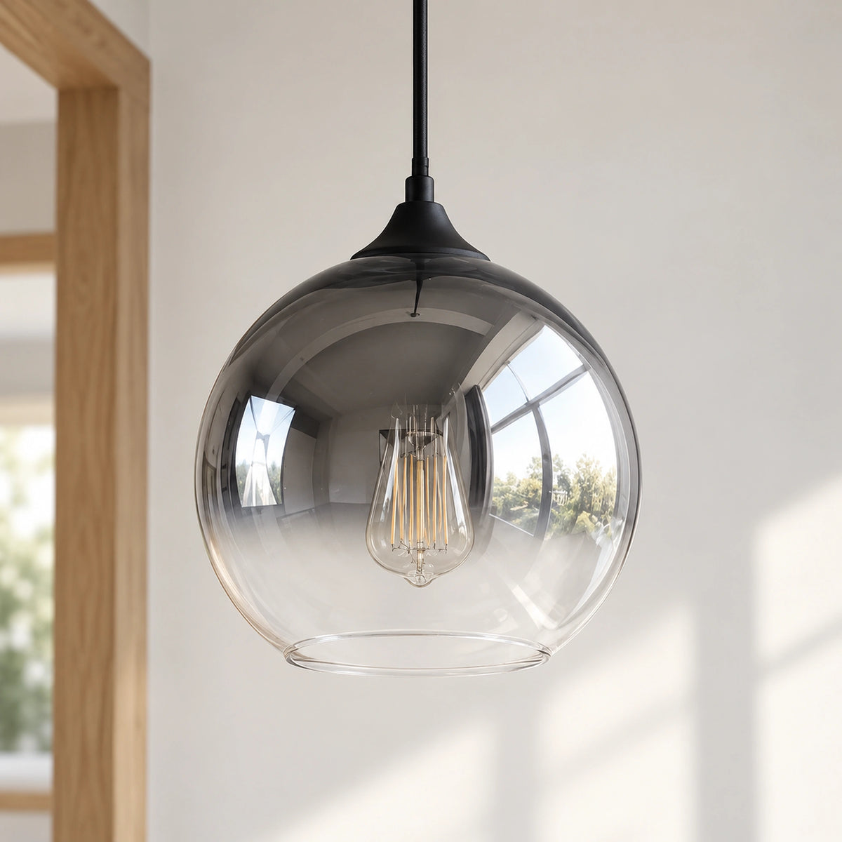 Glasstone Silver pendant unlit, with smoked grey upper glass fading to a clearer lower globe
