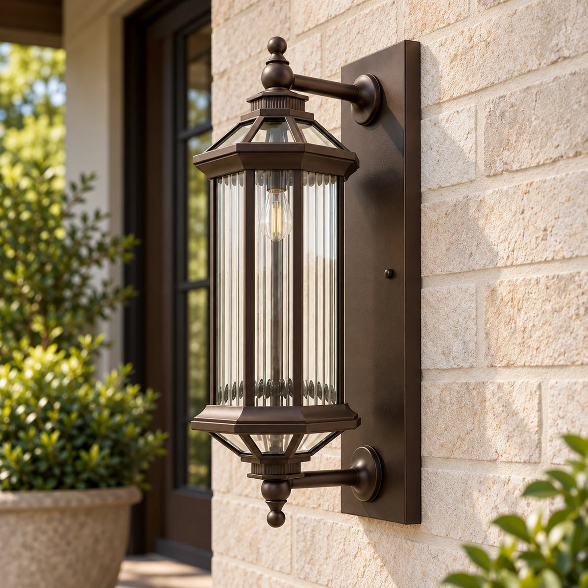 Angled view of the BronzeGlow wall lantern showing both mounting arms connected to the rectangular wall plate.