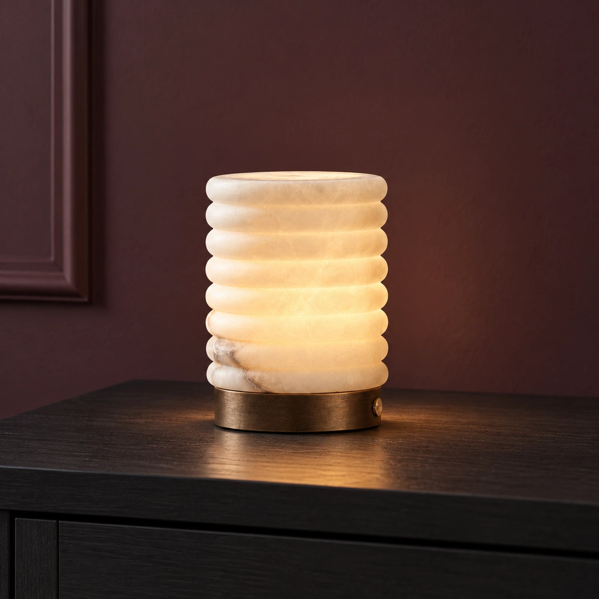 Large Nivelle ribbed alabaster cylinder lamp with Amber illumination, front view.