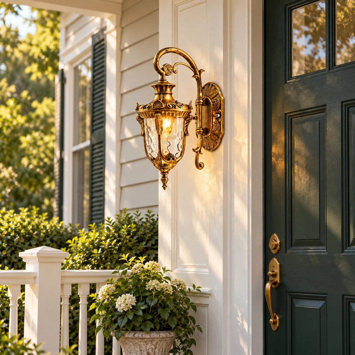 Flutera gold-finish textured-glass wall lantern beside a green front door on a traditional porch.